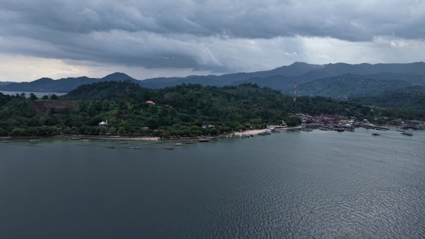 A serene lake surrounded by lush greenery and mountains