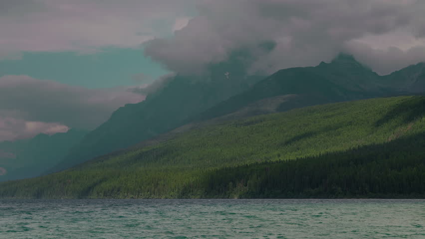 Majestic Montana mountains under cloudy skies, serene and calm landscape