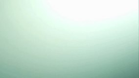 Vertical stream of turquoise colored water falling and breaking into many small droplets in slow motion against a bright white and green background - Powered by Shutterstock - Get 15% off with code: PIKWIZARD15