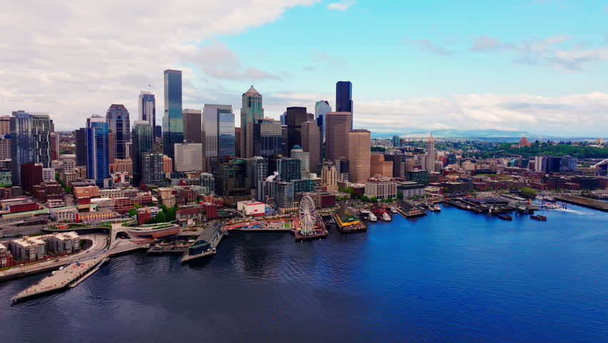 Aerial view over Seattle, Washington, USA, capturing the downtown skyline, urban landscape, and surrounding city environment from above. Ideal for travel and cityscape footage