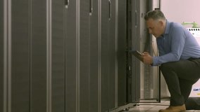 Animation of nft text over caucasian businessman in server room. global business, technology and digital interface concept digitally generated video. - Powered by Shutterstock - Get 15% off with code: PIKWIZARD15