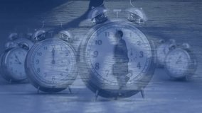 Animation of alarm clocks, data processing over businessman running. Global business, finance, connections, computing and data processing concept digitally generated video. - Powered by Shutterstock - Get 15% off with code: PIKWIZARD15