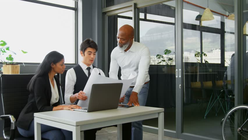 Animation of clock moving over diverse female and male coworkers in office. Business, cooperation, economy and time concept digitally generated video,