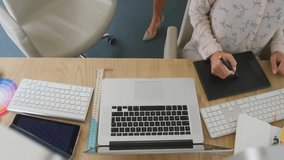 Animation of network of connections with icons over colleagues using computer. Global business and digital interface concept digitally generated video. - Powered by Shutterstock - Get 15% off with code: PIKWIZARD15