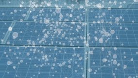 Male technician kneeling inspecting solar panels on solar farm, displaying energy network overlay. Renewable, technology, innovation, sustainability, professional, outdoor, connectivity - Powered by Shutterstock - Get 15% off with code: PIKWIZARD15