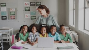 Animation of school icons over diverse schoolchildren and female teacher in classroom. School, education and learning concept digitally generated video. - Powered by Shutterstock - Get 15% off with code: PIKWIZARD15