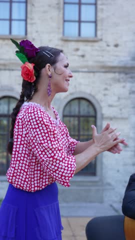 Beautiful Spanish woman claps her hands. Palmas handclaps in Spanish flamenco