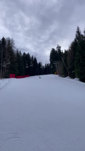Happy family in winter clothing at the ski resort, winter time in Italy, very cold weather