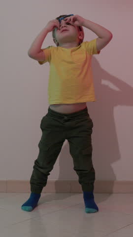 Young child dancing with sunglasses in a montage