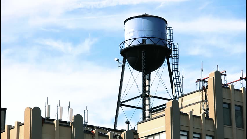 Editorial footage of a classic New York rooftop water tank on a residential building in SoHo, Manhattan. Timeless urban detail from early 2010s NYC