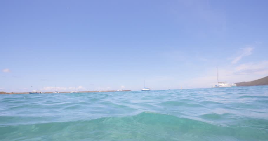 Tranquil underwater view showing turquoise waves and sunlight rippling on the ocean floor near the coast of Charleston, South Carolina.