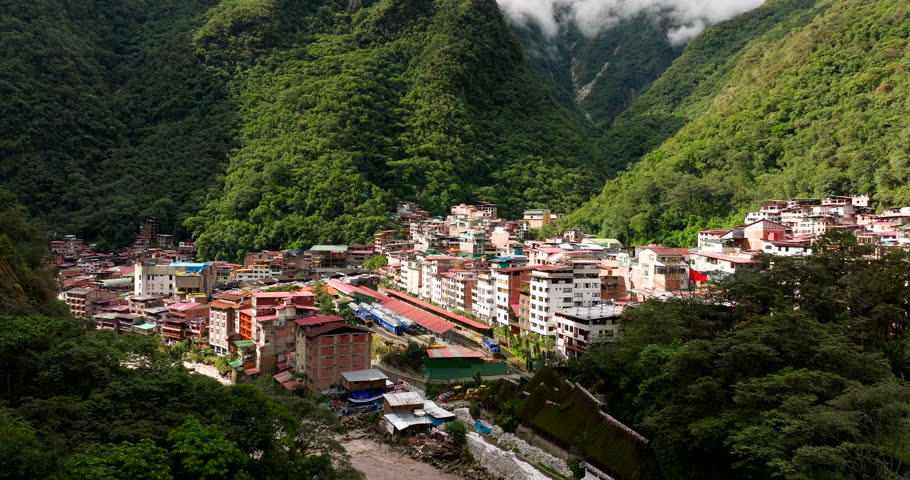 Aguas Calientes next to Urubamba in lush mountainous Cusco region, drone