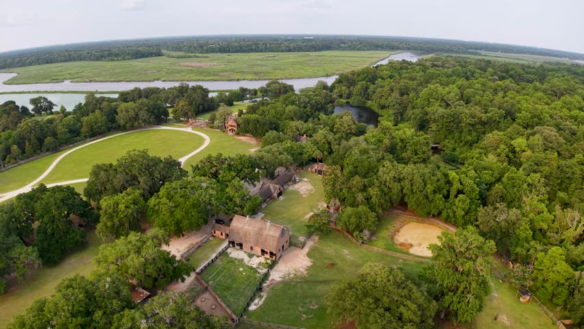 Drone footage offers a high-altitude view of Middleton Place Plantation buildings and manicured grounds near the marshes of Charleston, South Carolina.