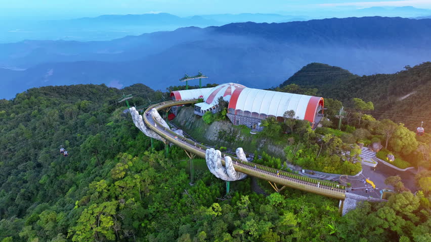 Tourist walking at Golden bridge in Bana hills, Da nang, Vietnam.