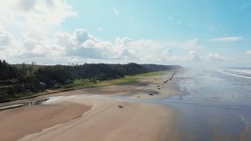 Aerial drone view of Seabrook, Washington, showing beach, Pacific Ocean waves, and coastal shoreline. Dynamic seaside scenery ideal for travel, nature, and ocean footage. - Powered by Shutterstock - Get 15% off with code: PIKWIZARD15