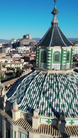 Aerial view of Iglesia de San Gil y Santa Ana church in Granada Spain on a clear sunny day. Architectural details of the dome and cityscape