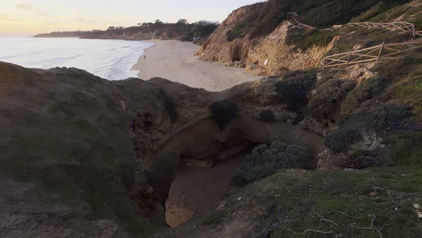 View of the sea and rocks of the beach of Olhos de Agua, Albufeira, Algarve, Portugal.