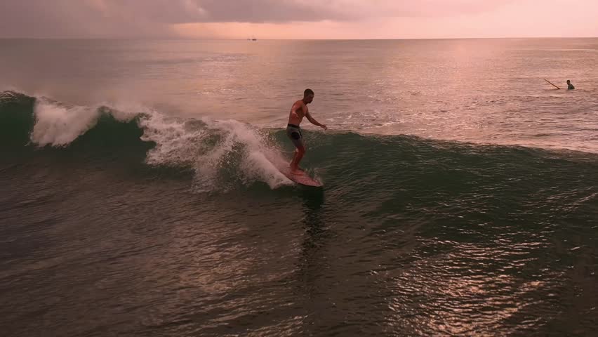 Sunset Longboarder Smooth Nose Ride, Mellow Golden Light On Calm Glassy Ocean, Reflective Horizon And Gentle