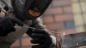 Welder performing arc welding on steel structure indoors - Powered by Shutterstock - Get 15% off with code: PIKWIZARD15