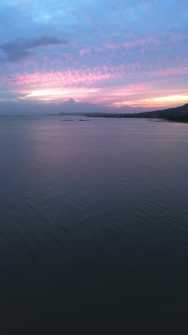 A beautiful sunset over the ocean with a calm and peaceful mood