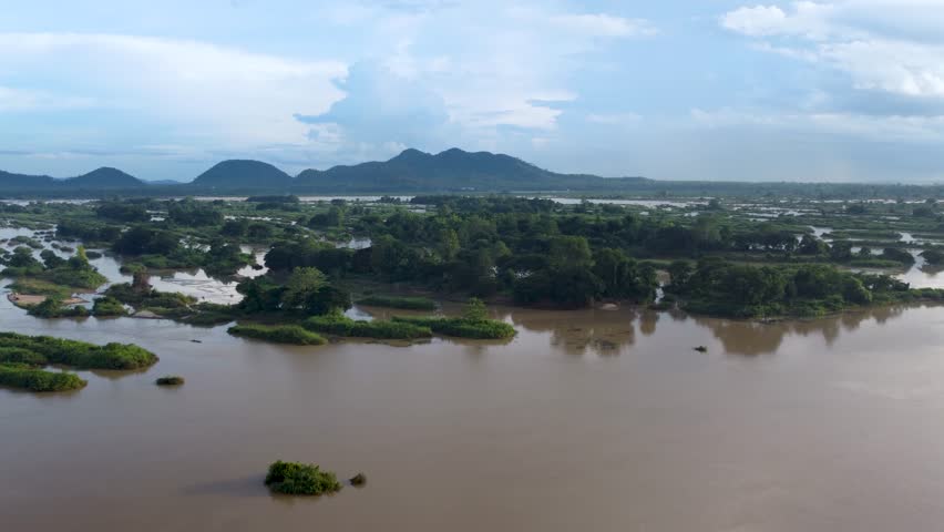 Wide aerial footage showing the Mekong River flowing through the 4000 Islands region near Don Det, Laos, with calm channels and small vegetated islands.