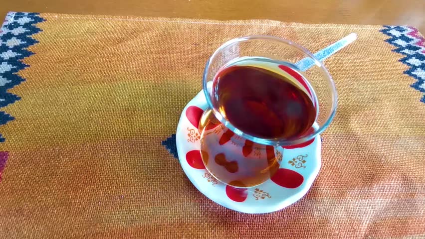 Turkish black tea chai in a glass on a restaurant table in Patong Beach Kathu District Phuket Island Province Southern Thailand in Southeast Asia.