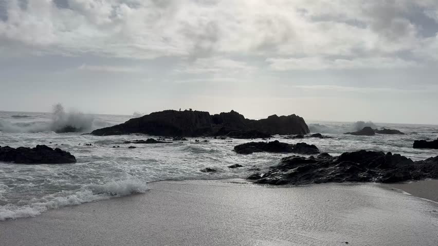 Shoreline at Bloubergstrand beach at sunset near Cape Town, South Africa.