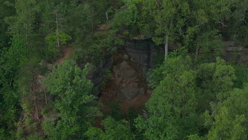 Aerial view of Grey's Arch, lush greenery, tranquil mood, Red River Gorge