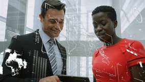 Animation of data processing over diverse businessman and businesswoman using digital tablet. Computer interface and business technology concept - Powered by Shutterstock - Get 15% off with code: PIKWIZARD15