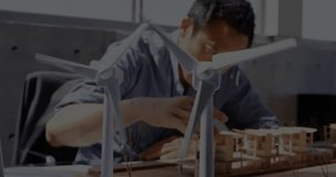 Animation of statistical data processing over asian male architect working on his model at office. Architectural engineering and business data technology concept - Powered by Shutterstock - Get 15% off with code: PIKWIZARD15