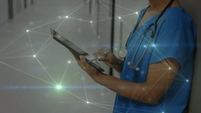 Animation of glowing network of connections over female health worker using digital tablet. Medical healthcare and technology concept - Powered by Shutterstock - Get 15% off with code: PIKWIZARD15