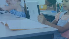 Student lifting tablet tapping screen in classroom learning forming green AR charts on device. Educational, digital, futuristic, interactive, children, learning, technology - Powered by Shutterstock - Get 15% off with code: PIKWIZARD15