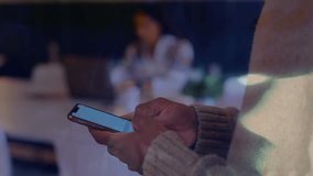 Animation of globe with data processing over businesswoman using smartphone. Global business, finance, computing and data processing concept digitally generated video. - Powered by Shutterstock - Get 15% off with code: PIKWIZARD15