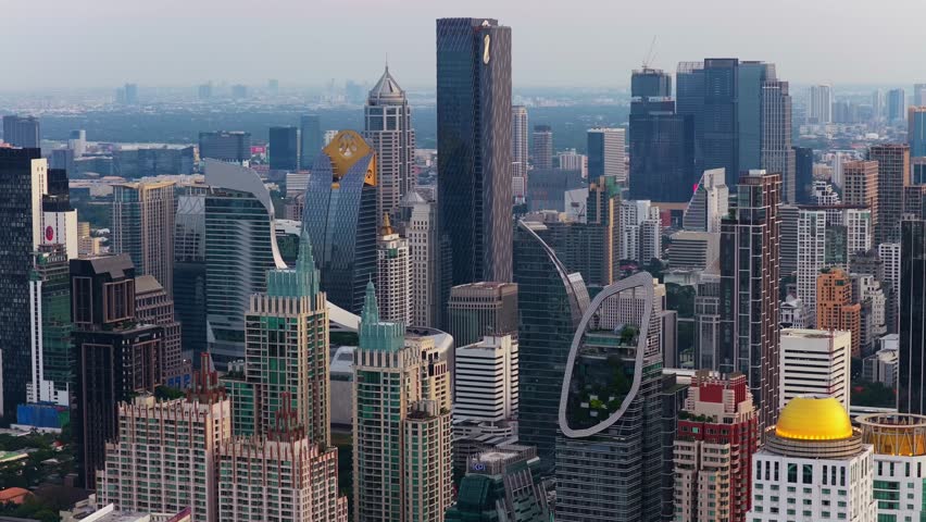 Expansive aerial view of the Bangkok skyline in Thailand. Modern metropolitan landscape featuring impressive skyscrapers and downtown buildings