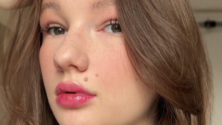 Happy smiling fashion model close up. Elegant female with perfect skin and pink glossy lips. Bright positive emotional lady. Fun Joyful Caucasian Woman. Skincare cosmetology beauty concept background