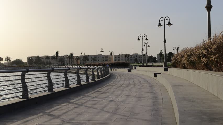 Scenic view of the modern Yanbu Waterfront promenade at the Royal Commission area, featuring curved pedestrian walkways, decorative lighting, and coastal architecture along the Red Sea in Saudi Arabia