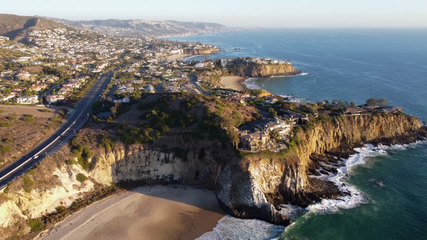 Laguna Beach, wide landscape view in Orange County California, USA. View looking south from Crystal Cove, Emerald Bay and Crescent Beach, Looking South, coastal cliffs, and sandy beaches.