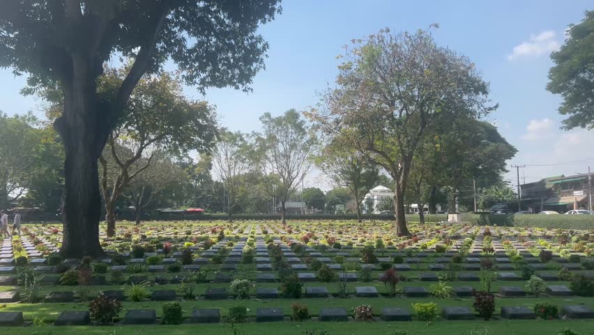 The Kanchanaburi War Cemetery (Don-Rak). quiet cemetery with rows of grave stones