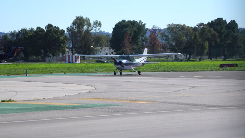 Small Propellor Airplane Prepares to Depart from Airport