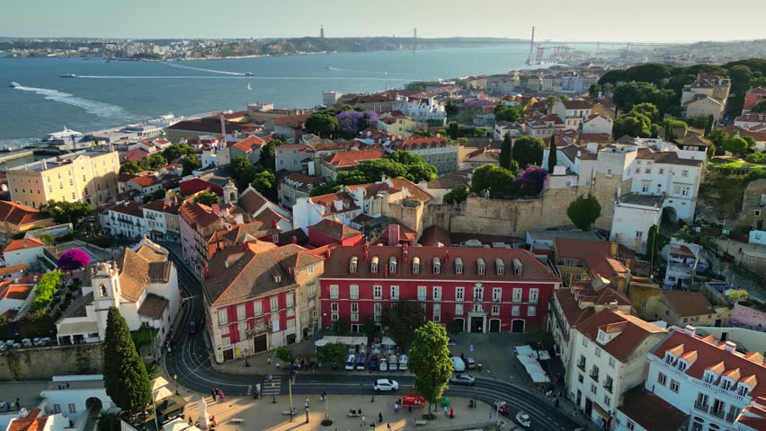 Historic rooftops of Alfama district in Lisbon, aerial view of traditional old town architecture. Traditional houses of Alfama in Lisbon seen from above, historic old town