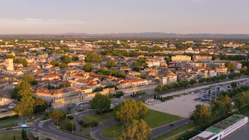 View of Avignon with Palais des Papes during sunset in Southern France. Medieval architecture along the Rhone River in Avignon, Provence, France. The Palais des Papes in Avignon, South France.