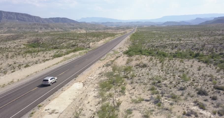 Car passing on highway in West Texas