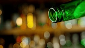 Pouring Beer from Bottle . Stream of Golden Carbonated Liquid Flows in Slow Motion on a Pub . Filmed on High Speed Cinematic Camera at 1000 FPS - Powered by Shutterstock - Get 15% off with code: PIKWIZARD15