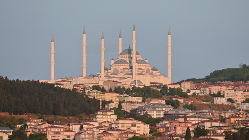 Istanbul,turkey,august 4, 2025. Majestic buyuk camlıca mosque standing on a hill in istanbul, turkey. The impressive islamic architecture glowing at sunset over the city