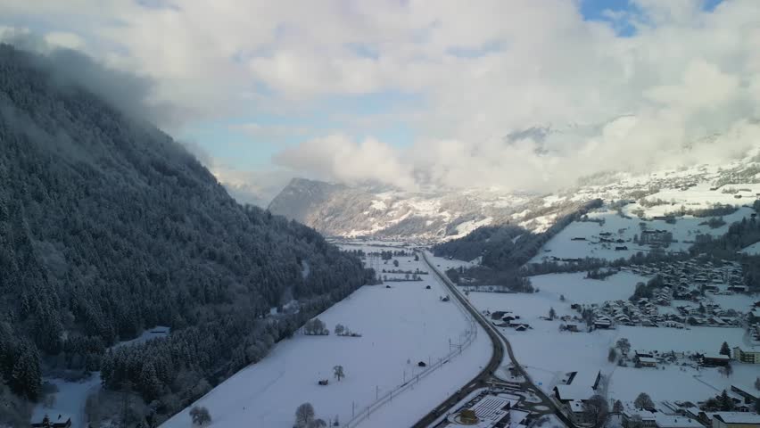 beautiful mountain at village side cover with snow
