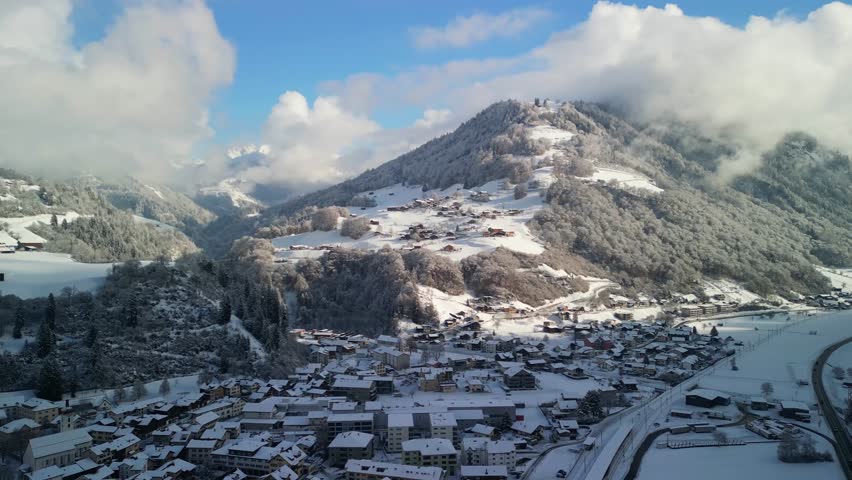 beautiful village and mountain that cover with snow