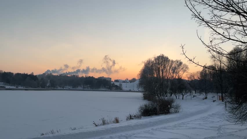 Winter sunset over a frozen lake