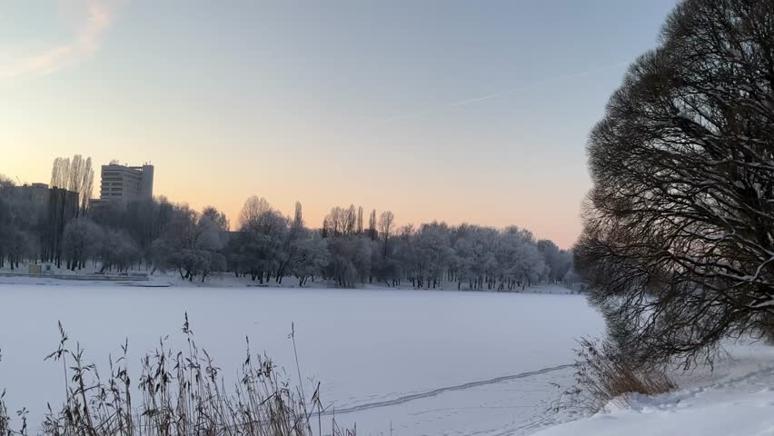 Winter sunset over a frozen lake