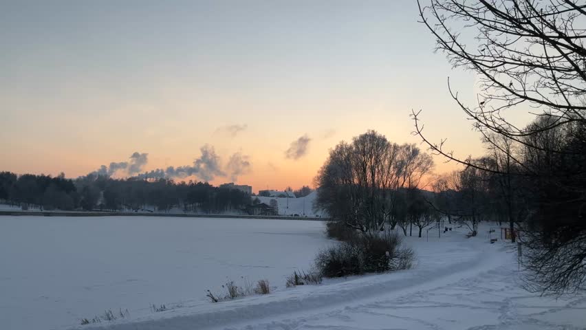Winter sunset over a frozen lake