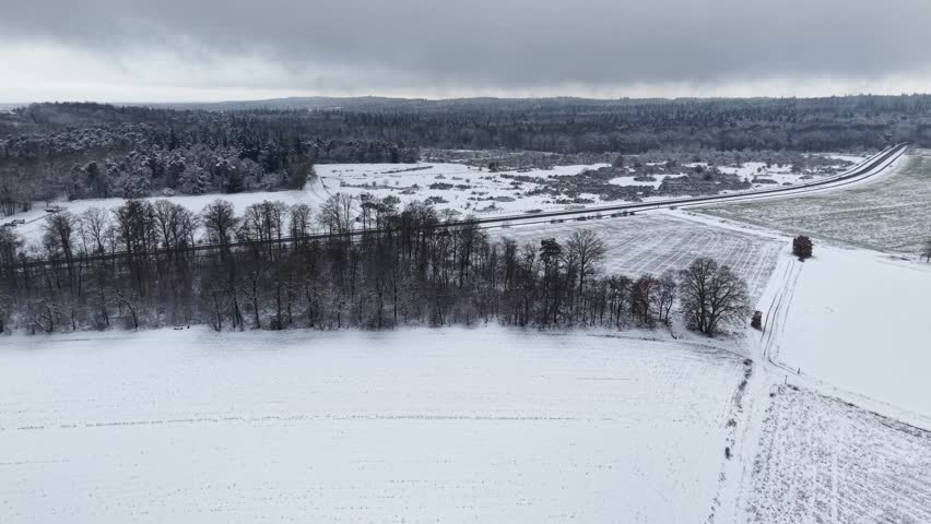 Aerial view of snowy forest landscape in winter